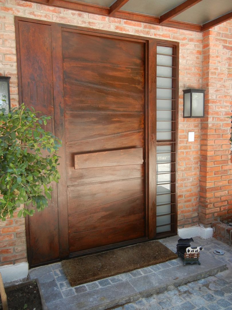 CASA EN LA HORQUETA, Fainzilber Arqts. Fainzilber Arqts. Modern style doors Doors