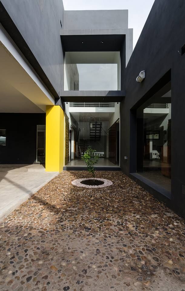 Casa Los Tipales L78, M2a Arquitectura APPaisajismo منازل