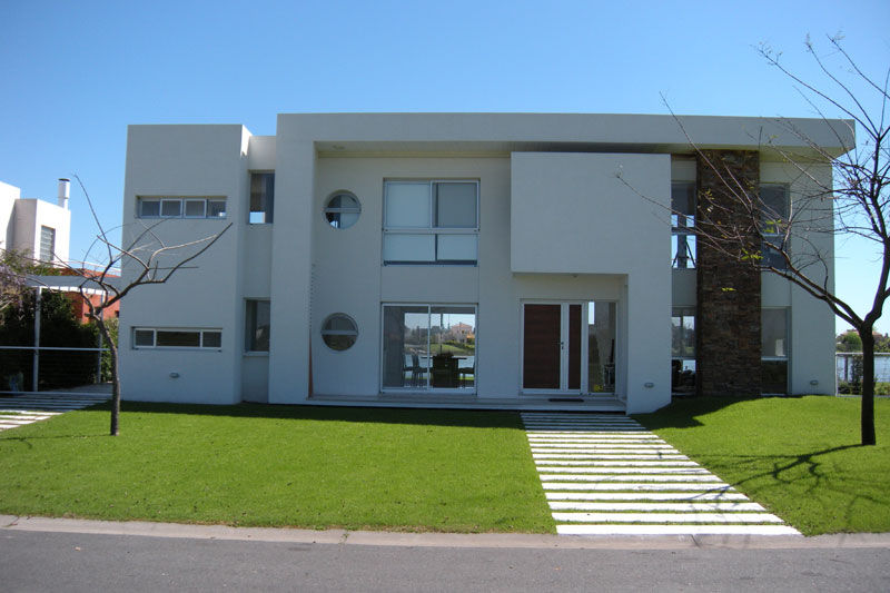 Casa San Isidro Labrador, arqpizzini arqpizzini Casas modernas