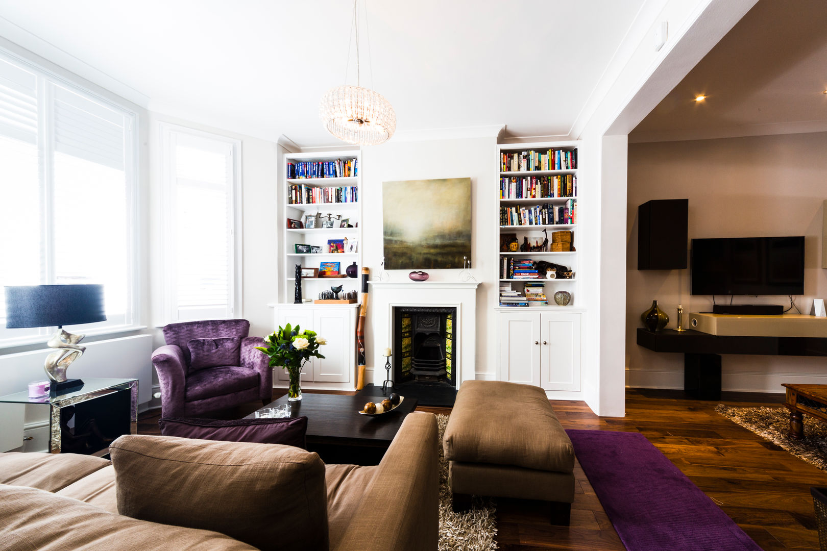 White Living Room with wooden floors, brown sofa, carpet and purple accents Affleck Property Services Гостиная в стиле модерн