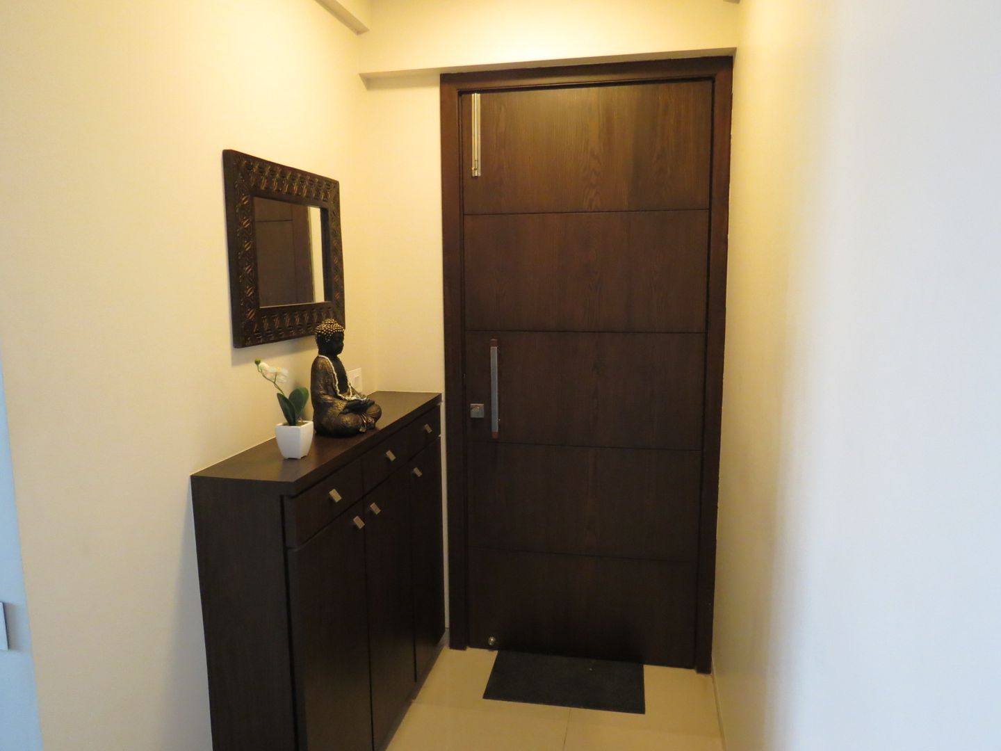 Resident in Mulund , TWISHA THAKKER TWISHA THAKKER Minimalist corridor, hallway & stairs Furniture,Cabinetry,Building,Fixture,Floor,Wood,Drawer,Flooring,Hardwood,Cupboard