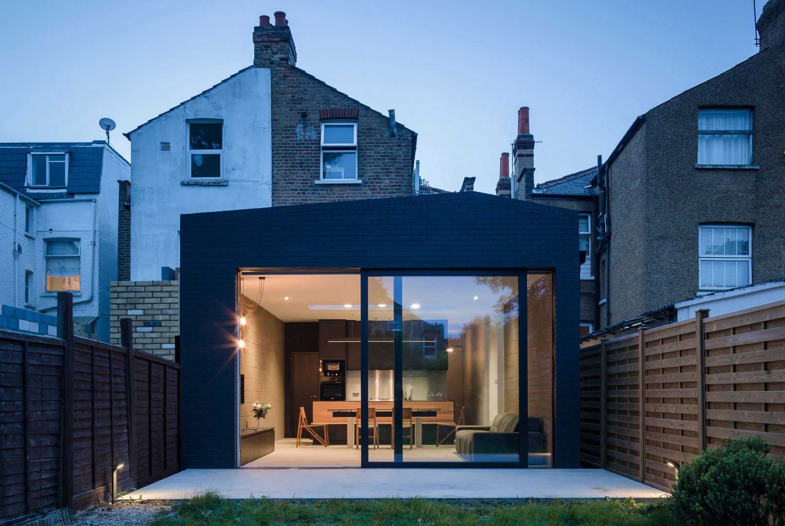 Rear elevation at dusk Mustard Architects Garden