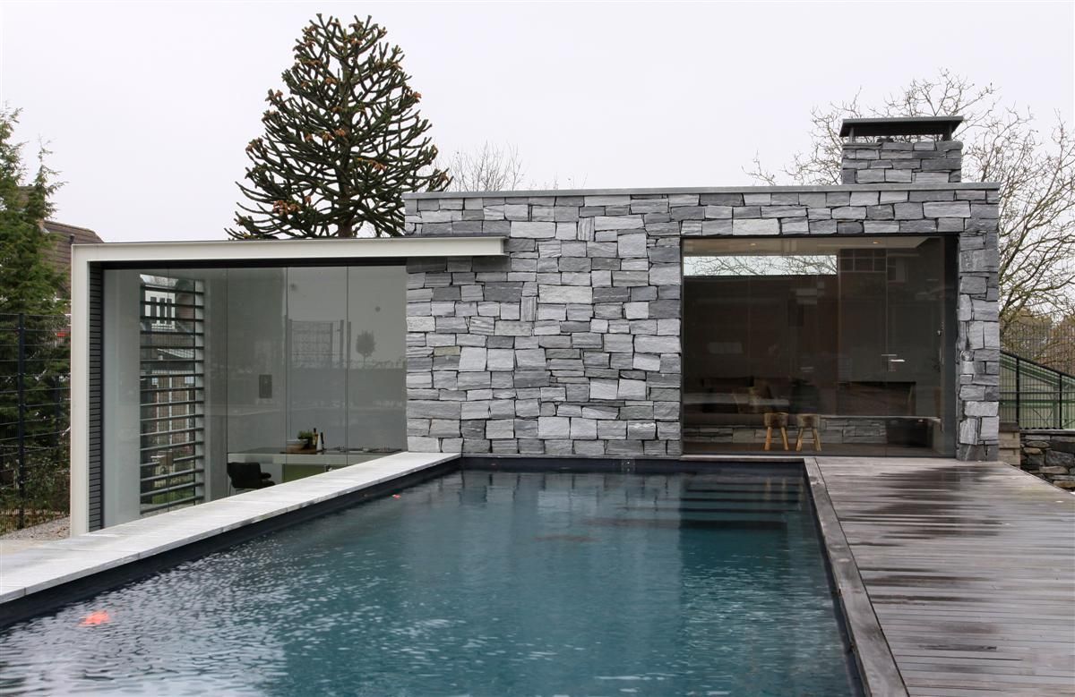 Poolhouse in graniet, Arend Groenewegen Architect BNA Arend Groenewegen Architect BNA Piscinas modernas Granito