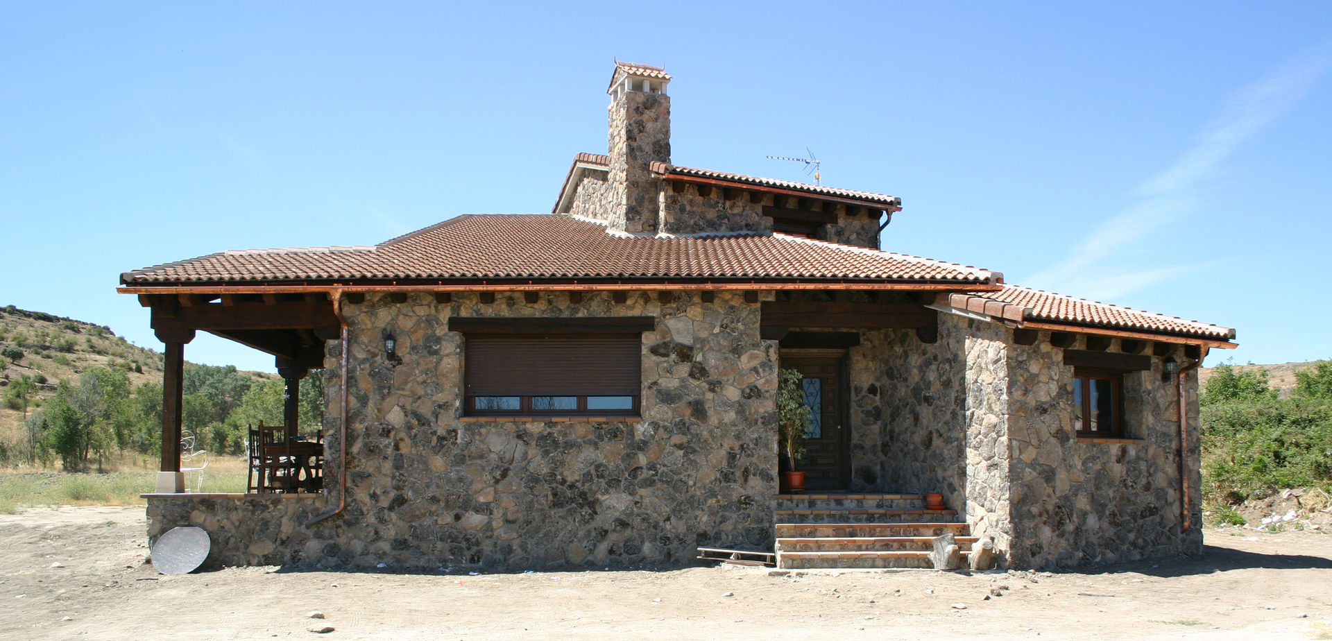 Fachada principal Arq0 Casas de estilo rústico