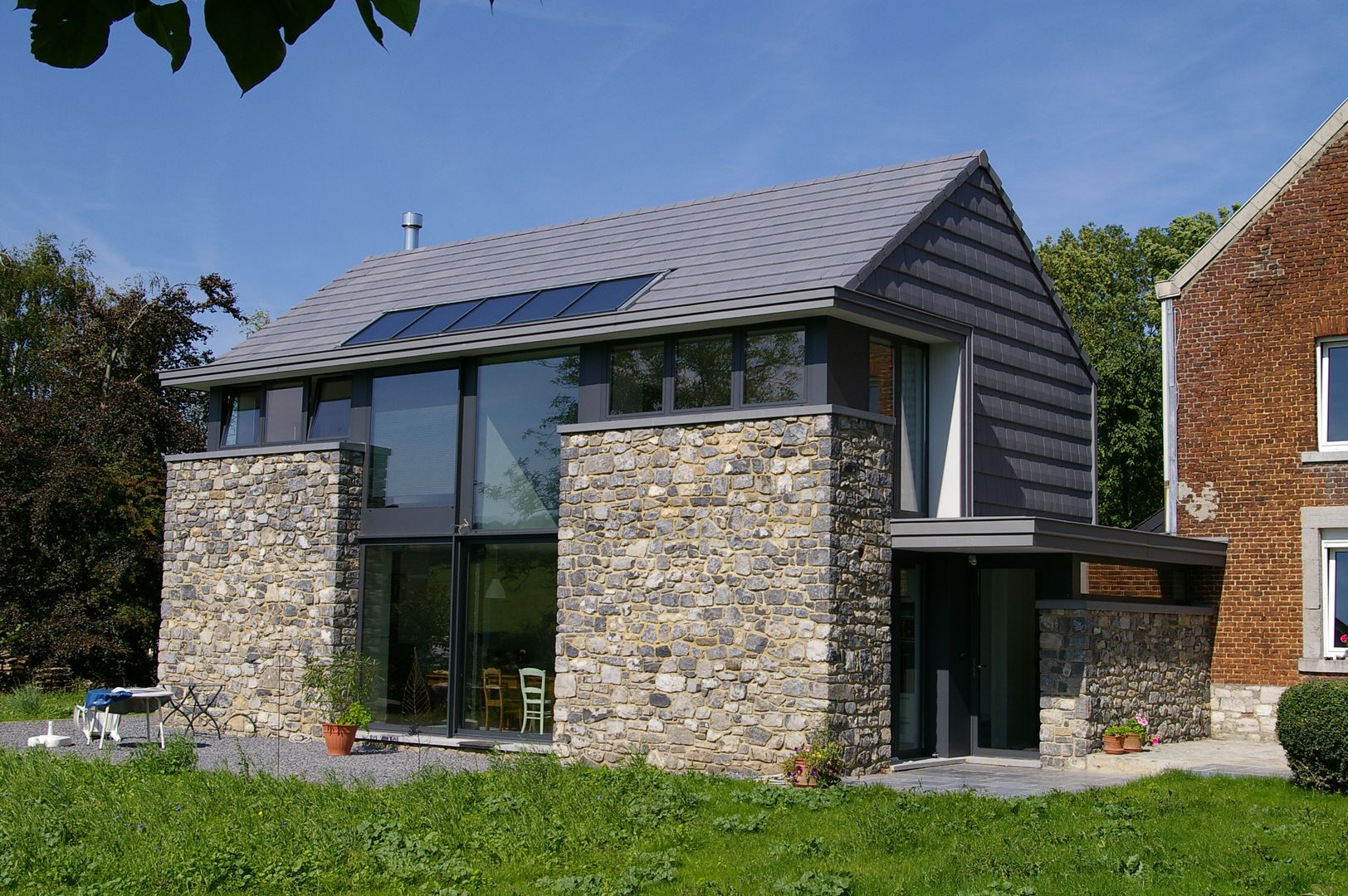 Maison lumineuse et écologique. , ARTERRA ARTERRA Casas de estilo ecléctico Piedra