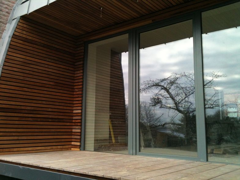 Extension tout en courbe à Sombreffe, Bureau d'Architectes Desmedt Purnelle Bureau d'Architectes Desmedt Purnelle Casas de estilo ecléctico Madera Acabado en madera