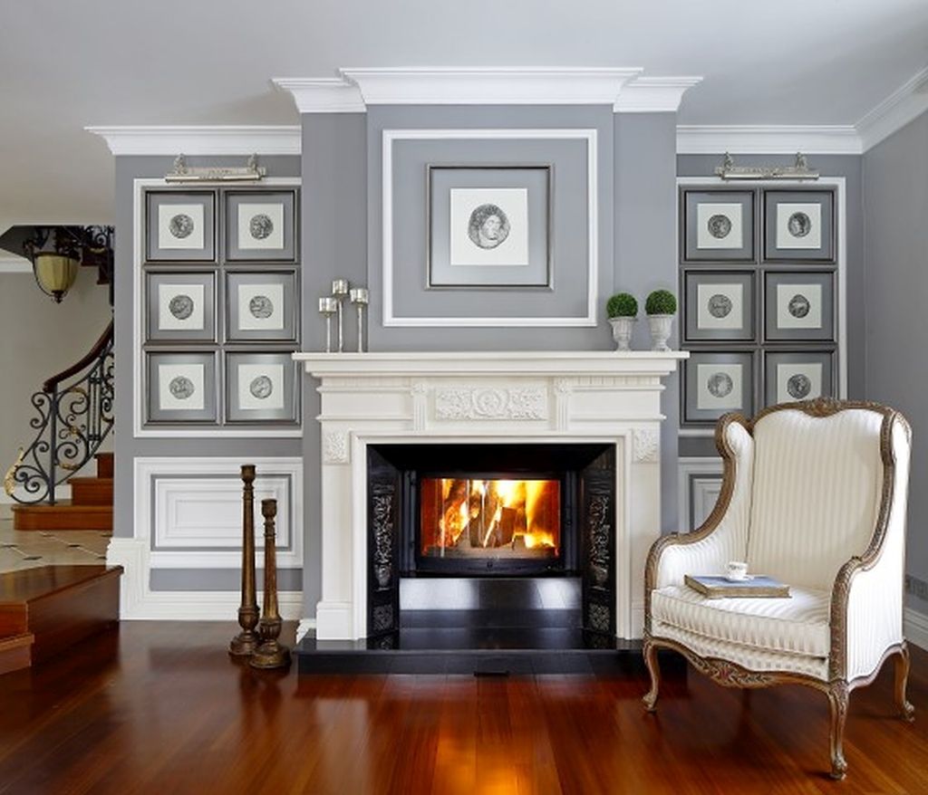 fireplace in the living room ARKITEX INTERIORS Salon moderne Calcaire Cheminées & accessoires