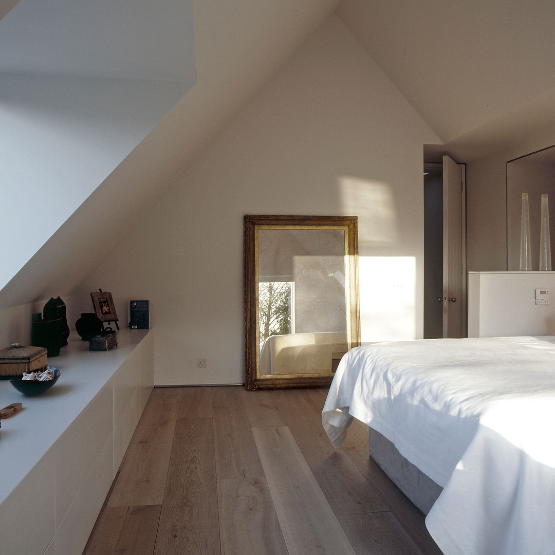 The bedroom at ​the Old Hall in Suffolk Nash Baker Architects Ltd Bedroom