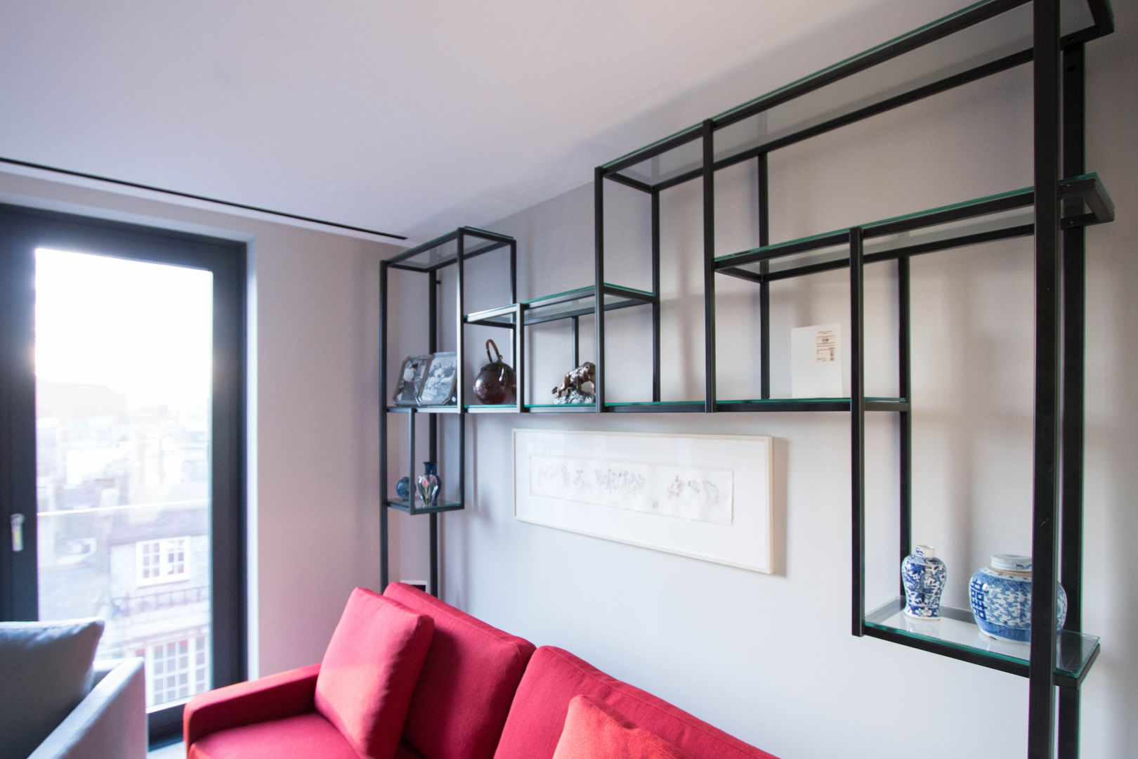 Glass shelving unit Railing London Ltd Modern living room Steel unit with glass shelves.