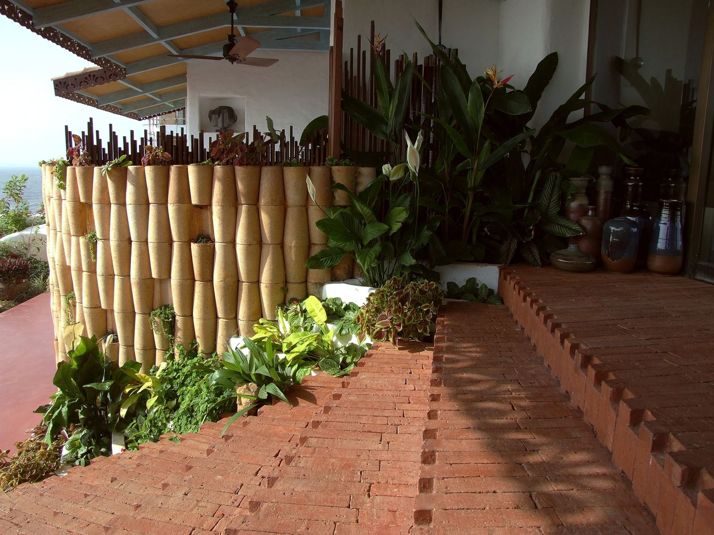 Vertical wall plater and steps The White Room Mediterranean style garden