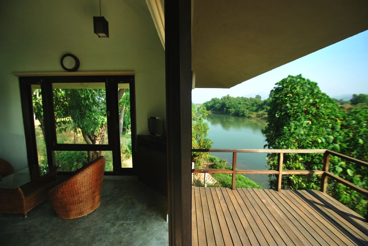 Wooden Deck over river The White Room Tropical style houses