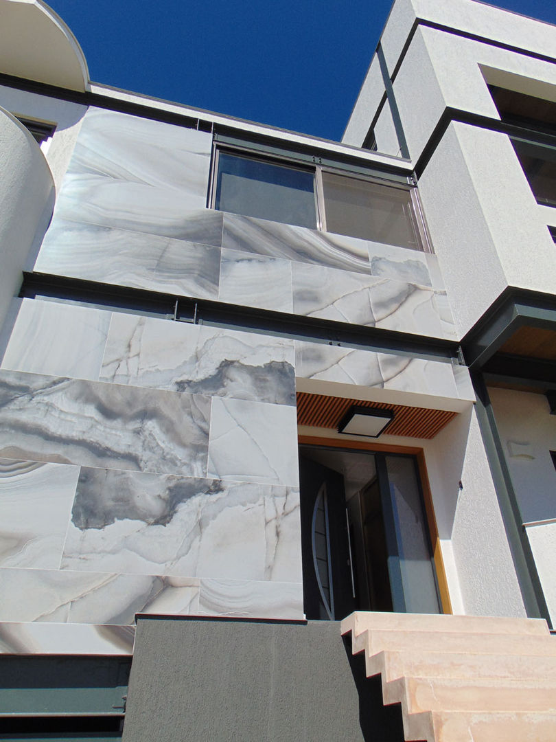 Detalhe revestimento fachada homify Casas modernas