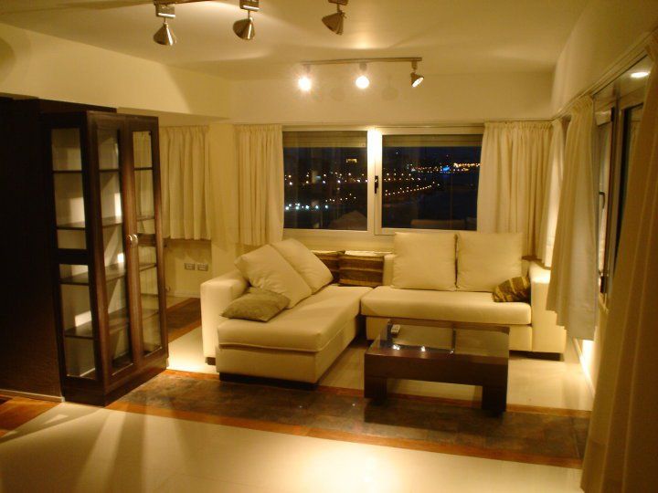 Remodelación Departamento en Cabo Corrientes, ArqmdP - Arquitectura + Diseño ArqmdP - Arquitectura + Diseño Scandinavian style living room