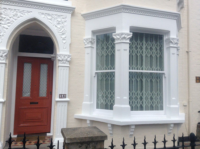 Exterior house painting, Clapham Common The Hamilton Group wood exterior,bay window,double windows,window ledge,wall painting