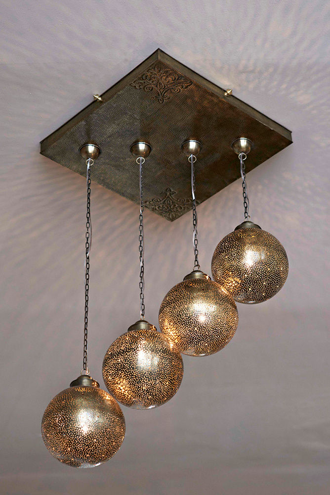 Lámpara colgante en bronce artesanal homify Cuartos de estilo mediterráneo Cobre/Bronce/Latón Iluminación