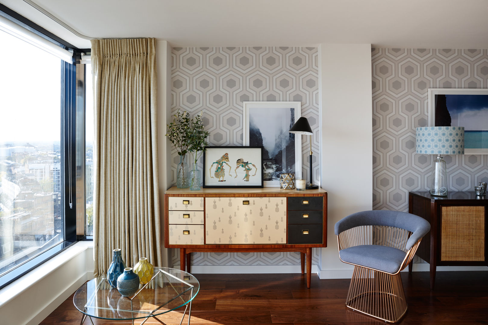 Gloucester Road Penthouse Bhavin Taylor Design Modern living room living room,sideboard,wallpaper,table lamp,midcentury,armchair,coffee table,pineapple print,curtains,grey,yellow,walnut flooring