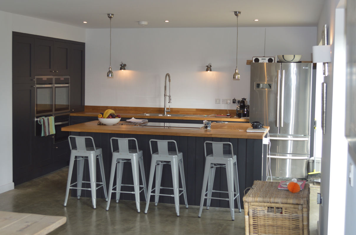 New kitchen with Oak Worktops and Integrated Appliances ArchitectureLIVE kitchen island,kitchen appliances,kitchen lighting,oak worktop,induction hob,pull-out hose tap,kitchen chairs,integrated appliance,polished concrete,concrete flooring,1960s house,renovation