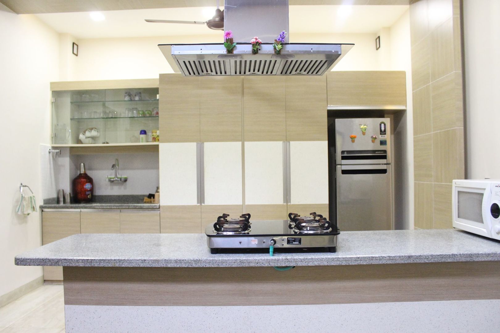 Duplex in Indore, Shadab Anwari & Associates. Shadab Anwari & Associates. Asian style kitchen Cabinetry,Property,Countertop,Tap,Wood,Lighting,Interior design,Kitchen,House,Flooring