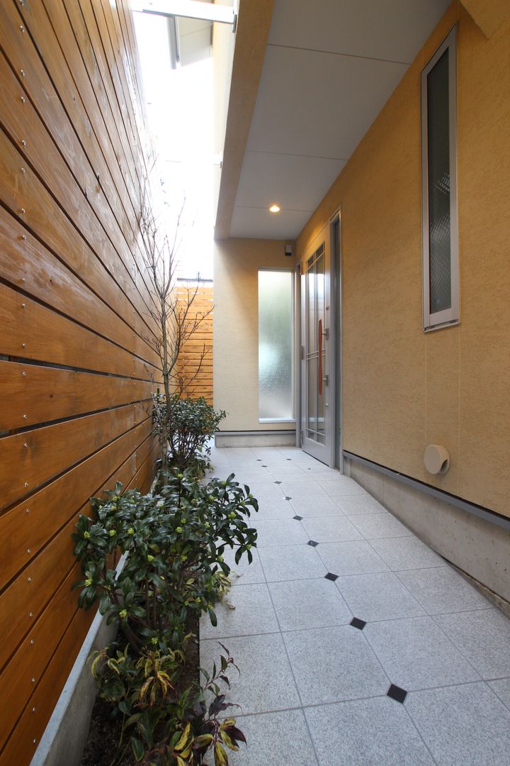 中庭とビルトインガレージのある家, ＡＴＳ造家設計事務所 ＡＴＳ造家設計事務所 Jardines de estilo moderno Granito