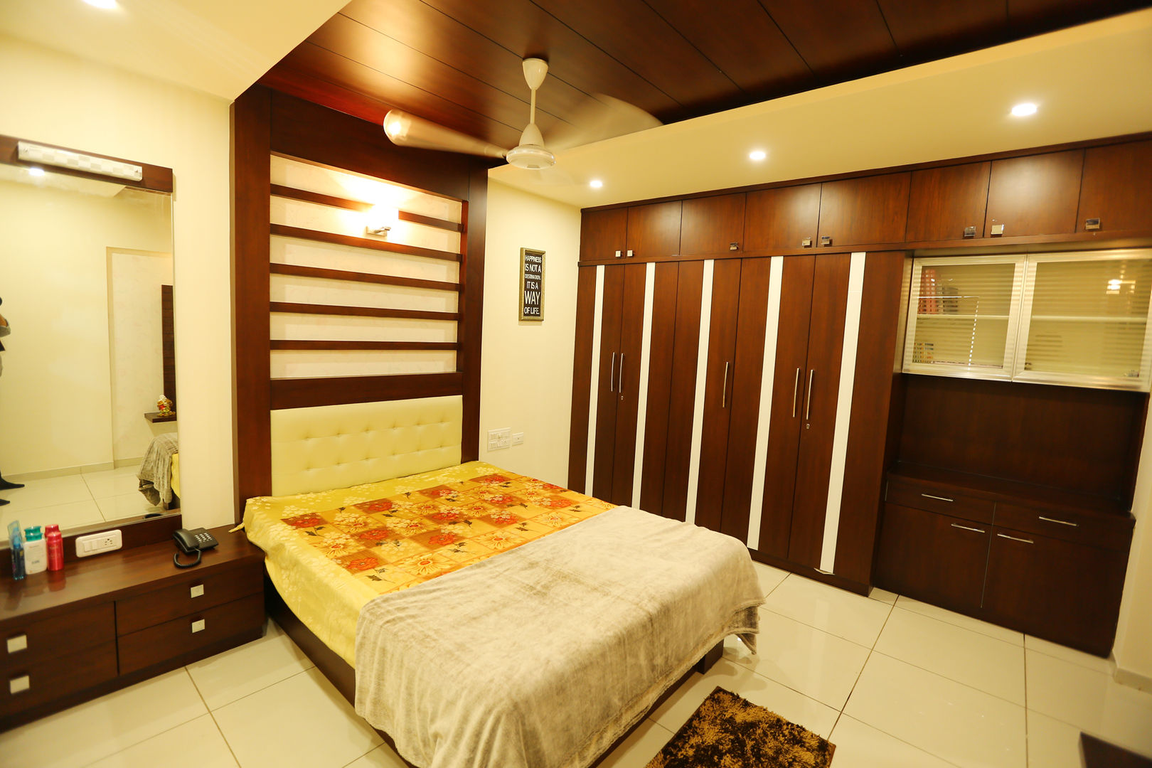 Independent house Manglore.., Ashpra Interiors Ashpra Interiors Tropical style bedroom Cabinetry,Property,Furniture,Comfort,Wood,Building,Door,Interior design,Flooring,Drawer