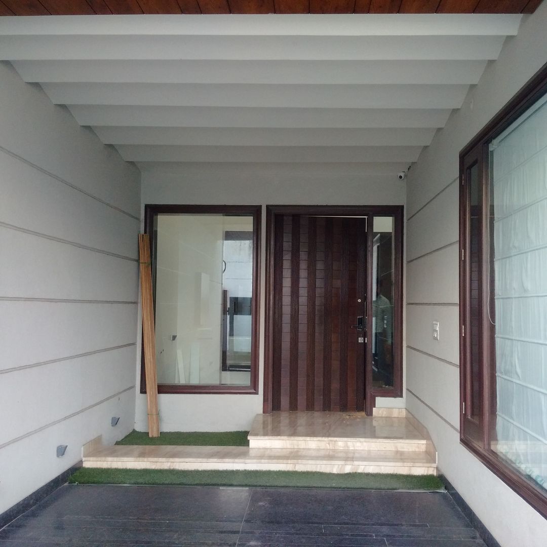 Residence For Mr Akshdeep S, H.S.SEHGAL & ASSOCIATES H.S.SEHGAL & ASSOCIATES Moderne garage