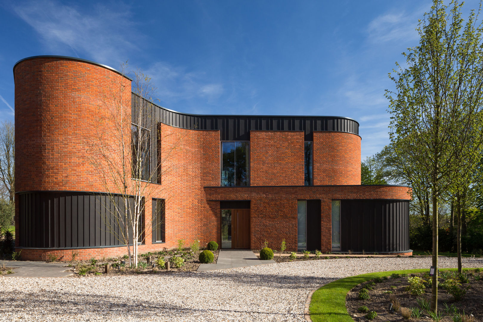 Incurvo, Adrian James Architects Adrian James Architects Casas modernas Ladrillos brick,curves,zinc,modern,light,bright,curved