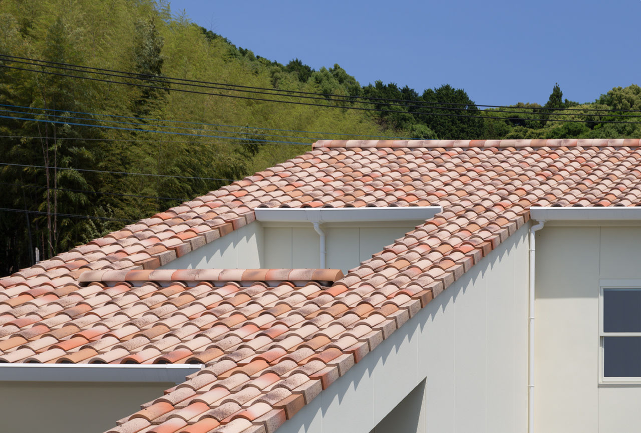 ORANGE HAUS, 田村の小さな設計事務所 田村の小さな設計事務所 Mediterranean style house Bricks