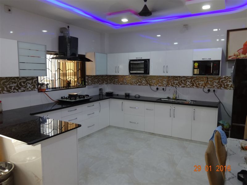 high gloss white hdf material aashita modular kitchen Modern kitchen MDF Property,Countertop,Cabinetry,Building,Interior design,Kitchen,Floor,Architecture,Flooring,Living room