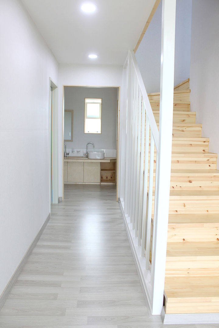 homify Country style corridor, hallway & stairs