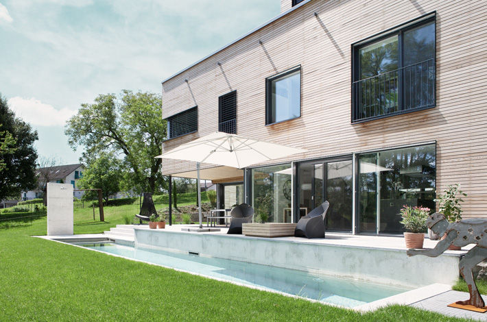 Villa aus Holz am Murtensee, Unica Architektur AG Unica Architektur AG Modern pool