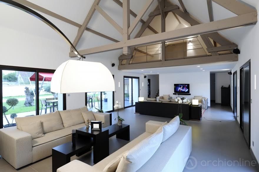 Rénovation d'une maison traditionnelle en maison moderne et luxueuse, Archionline Archionline Modern living room