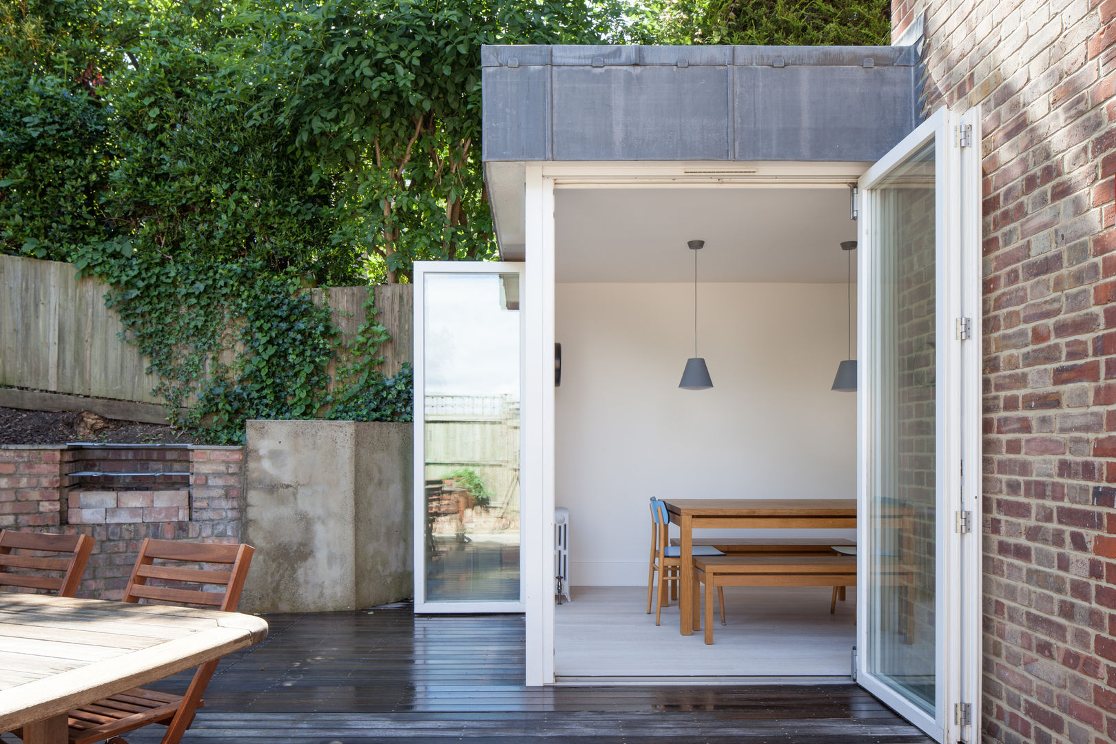 View of Dining Room from garden patio deDraft Ltd Scandinavian style dining room Metal