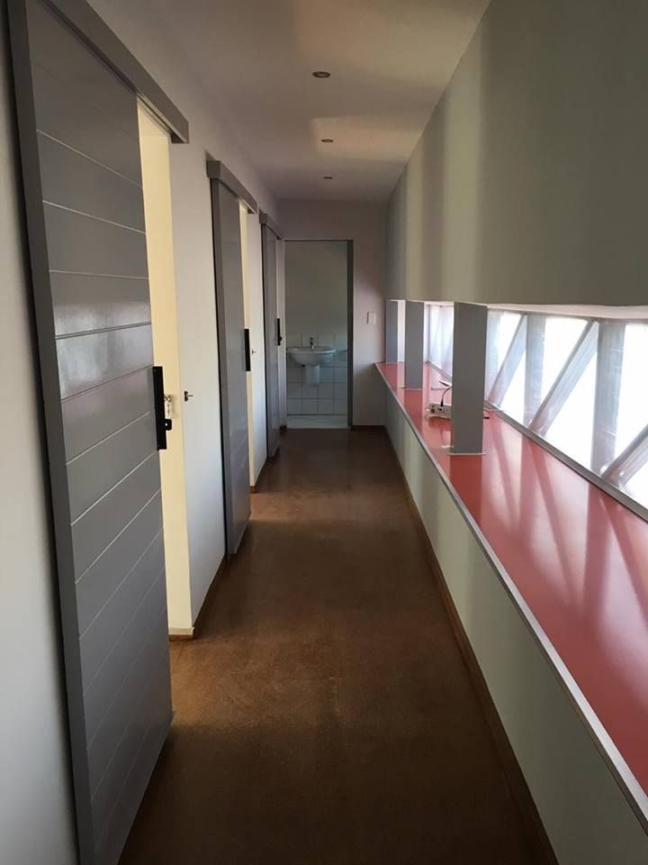 Passage A4AC Architects Modern corridor, hallway & stairs Metal