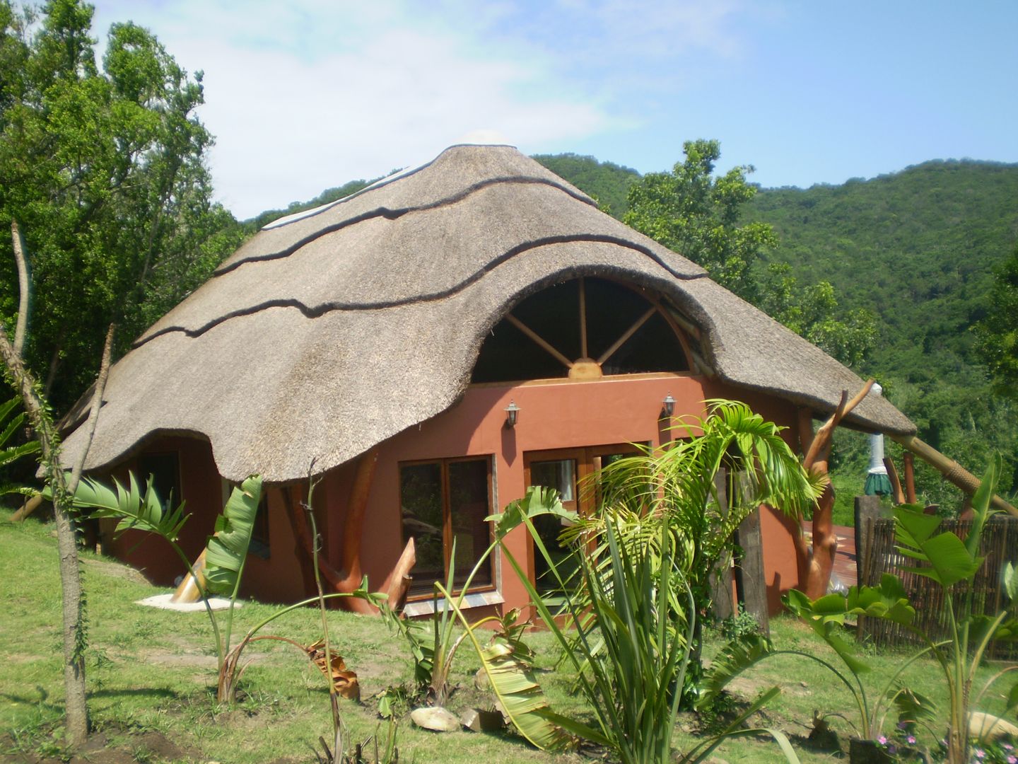 Thatched Roof on Residential Home Bosazza Roofing & Timber Homes Rustic style house