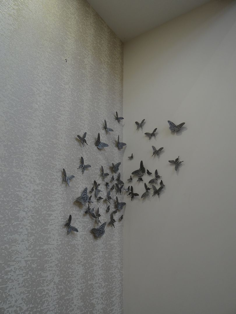 Butterfly motifs on the wall homify Modern walls & floors