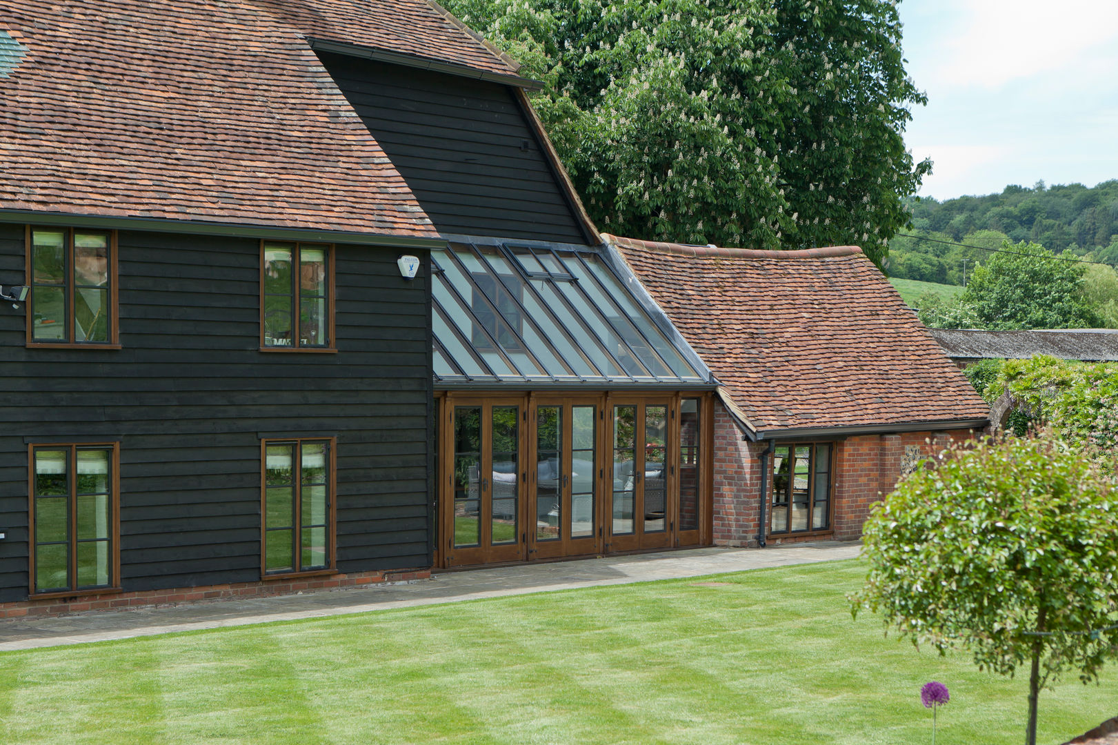 Barn Conversion with Oak Conservatory Vale Garden Houses Konservatori Gaya Rustic Kayu Wood effect conservatory,orangery,garden room,outdoor,bespoke,timber,aluminium,glass,roof light,roof light