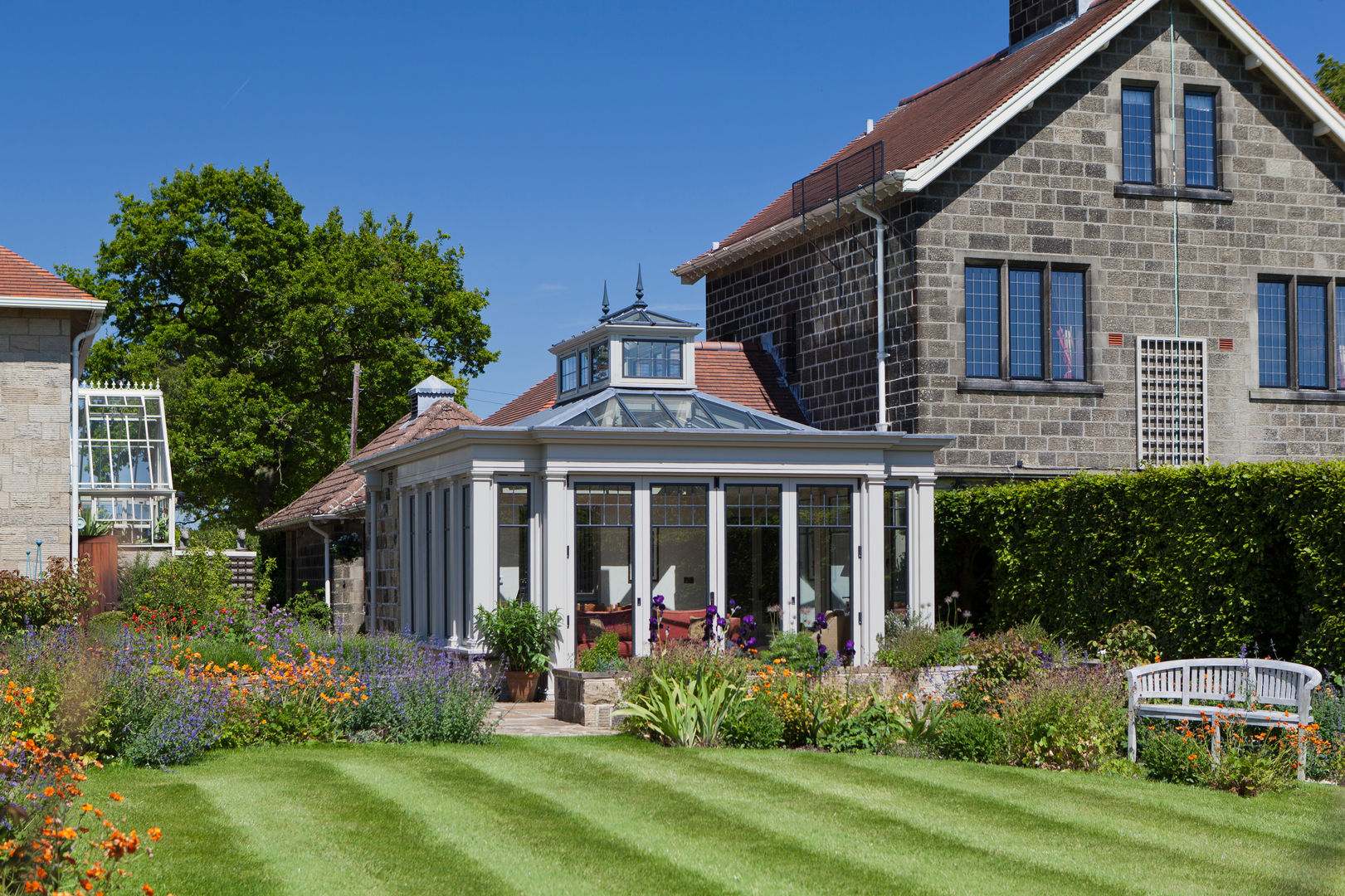 Conservatory with Bronze Casement Windows on a Period Farmhouse Vale Garden Houses Conservatory لکڑی Wood effect