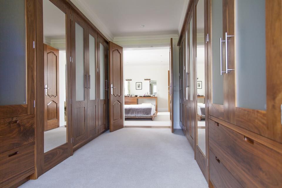 Dressing room - Fitted walnut wood cabinetry Baker & Baker Modern style bedroom wardrobes,mirrors,drawers,dressing room