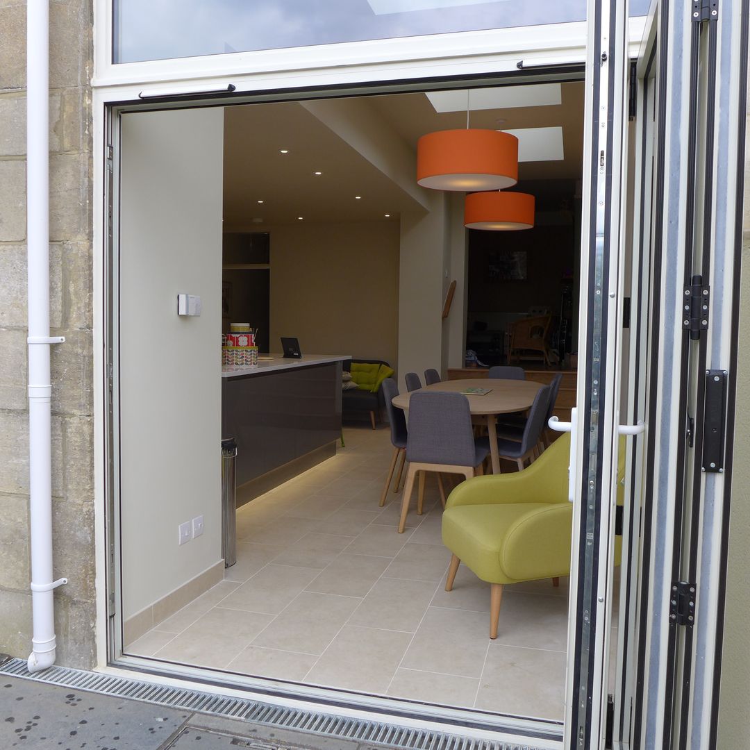 Modern gloss grey kitchen in side return extension Style Within Modern Kitchen gloss,grey,kitchen,modern kitchen,patio doors,bifold doors,extension,porcelain tiles