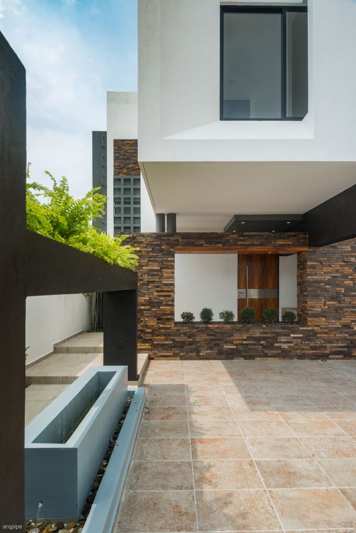 Casa Ax4, ROKA Arquitectos ROKA Arquitectos Nhà phong cách tối giản Gạch ốp lát