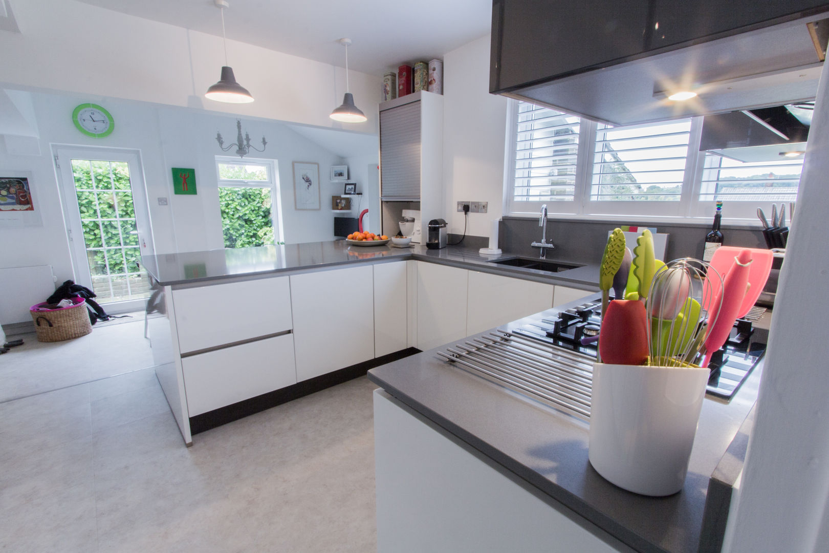 Practical Magic Eco German Kitchens Кухня MDF Nobilia kitchen furniture,Mineral grey Quartzforms worktops,open plan design,Neff single oven,Neff combi microwave,Neff gas hob,integrated appliances,stainless steel tambour unit.