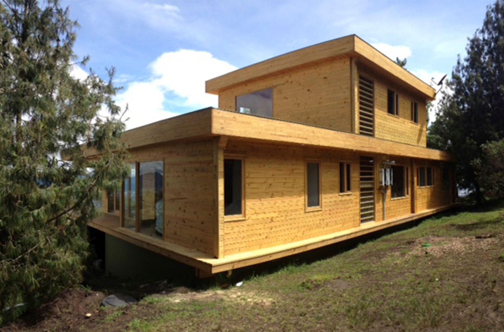 Vivienda suburbana en madera, Taller de Ensamble SAS Taller de Ensamble SAS 모던스타일 주택 우드 우드 그레인