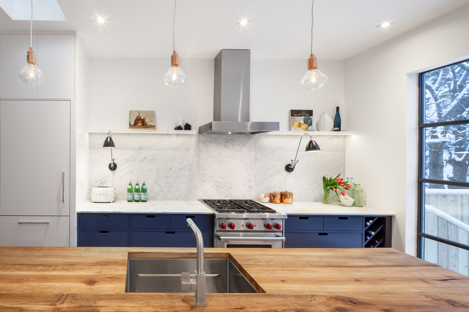 Main Kitchen Line with Marble Backsplash STUDIO Z Kitchen Cabinetry,Property,Countertop,Furniture,Table,Wood,Kitchen stove,Kitchen,Lighting,Interior design