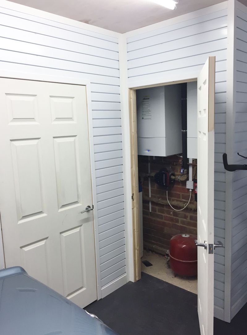 Great Storage Solutions and a Striking Tiled Floor in Little Chalfont, Buckinghamshire Garageflex Garagens e arrecadações modernas boiler,pipework,metres,garageflex