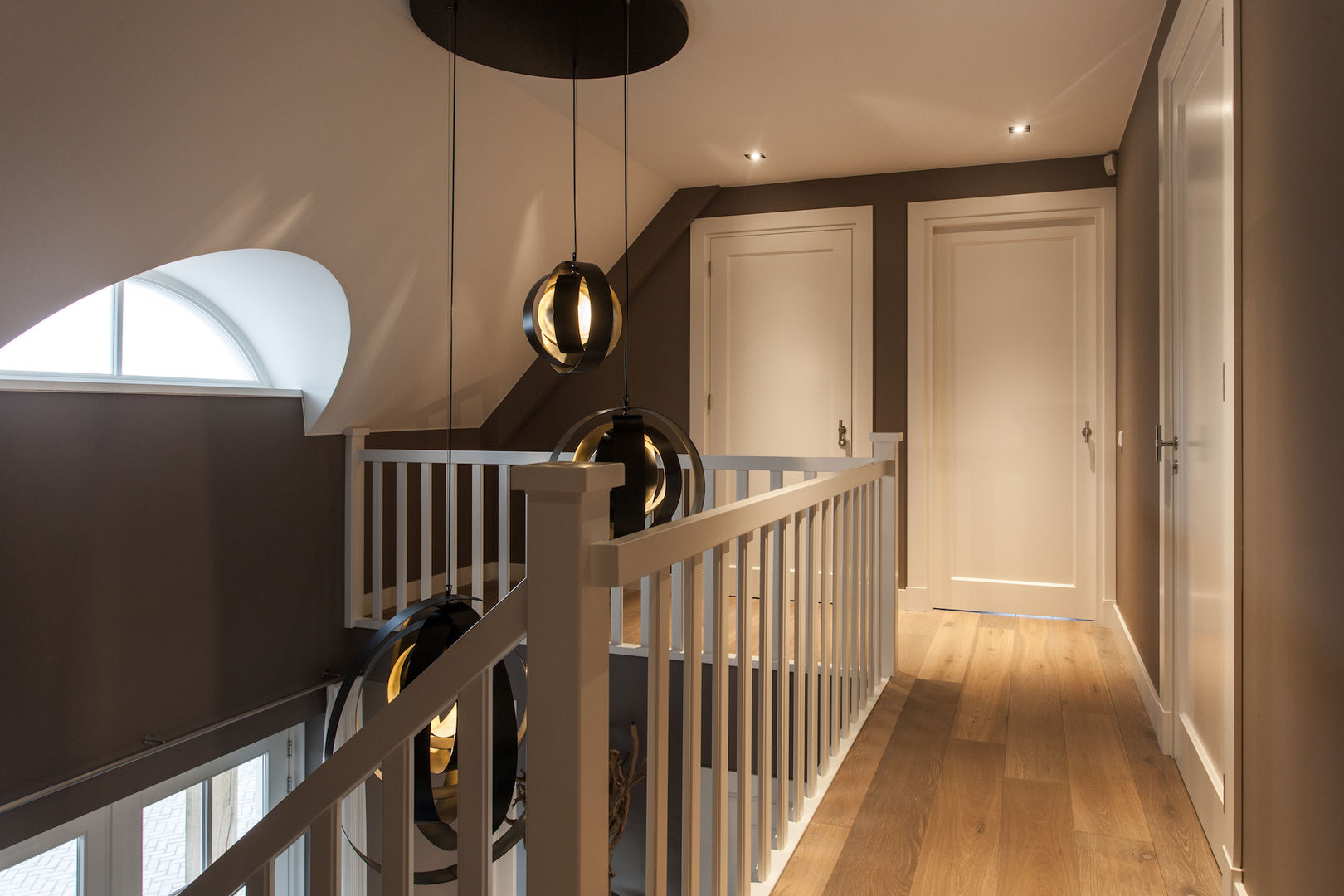 homify Modern corridor, hallway & stairs Lighting