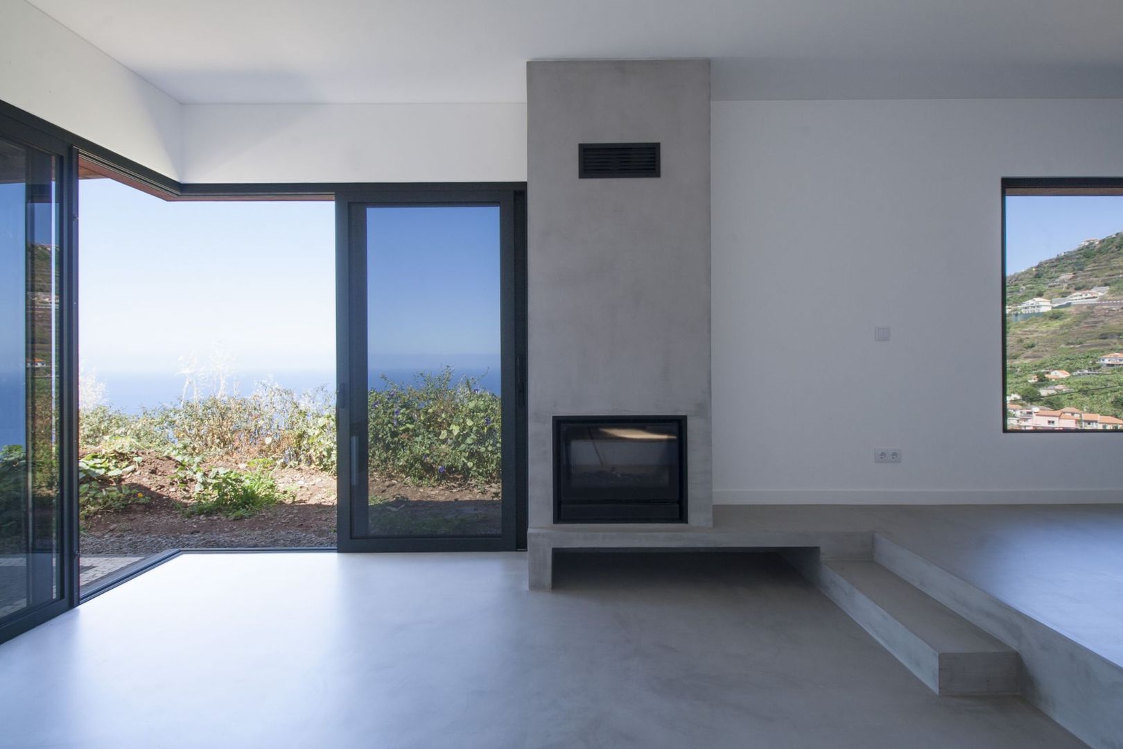 Living Room Mayer & Selders Arquitectura ミニマルデザインの リビング コンクリート microcement,ocean view,living room