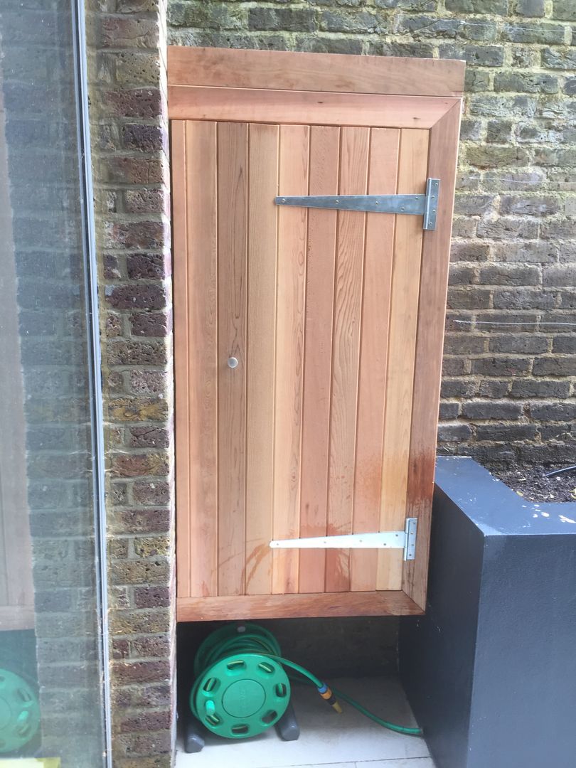 Funky Family Garden in Chiswick, GreenlinesDesign Ltd GreenlinesDesign Ltd Jardines de estilo ecléctico garden storage