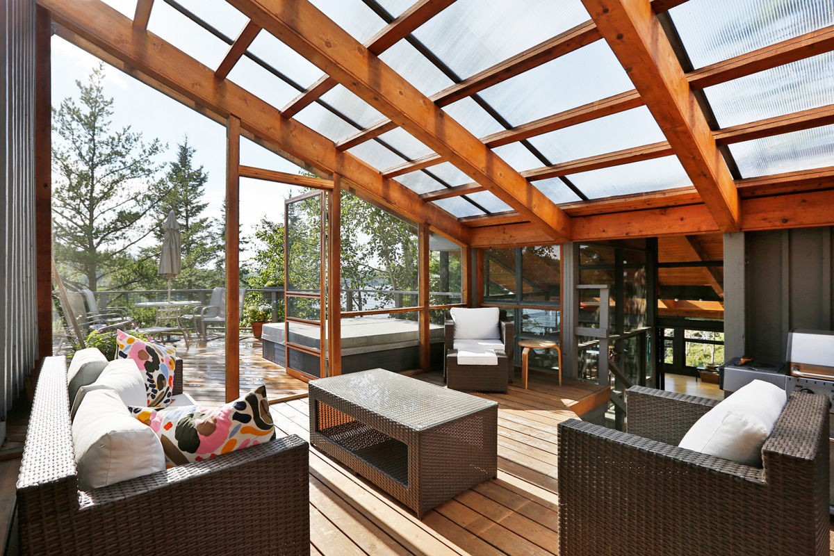 West hawk Lake Cottage, Unit 7 Architecture Unit 7 Architecture Modern conservatory exterior,interior,sunroom,manitoba,sky lights,deck,modern,cottage,cabin,contemporary