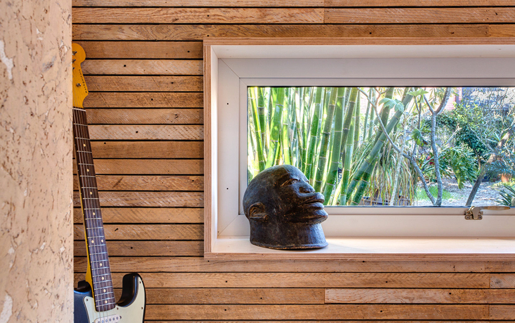 Studio Retreat, New Orleans studioWTA Media room window trim,wood lath,cork tile,shelving,studioWTA,Wayne Troyer,Tracie Ashe