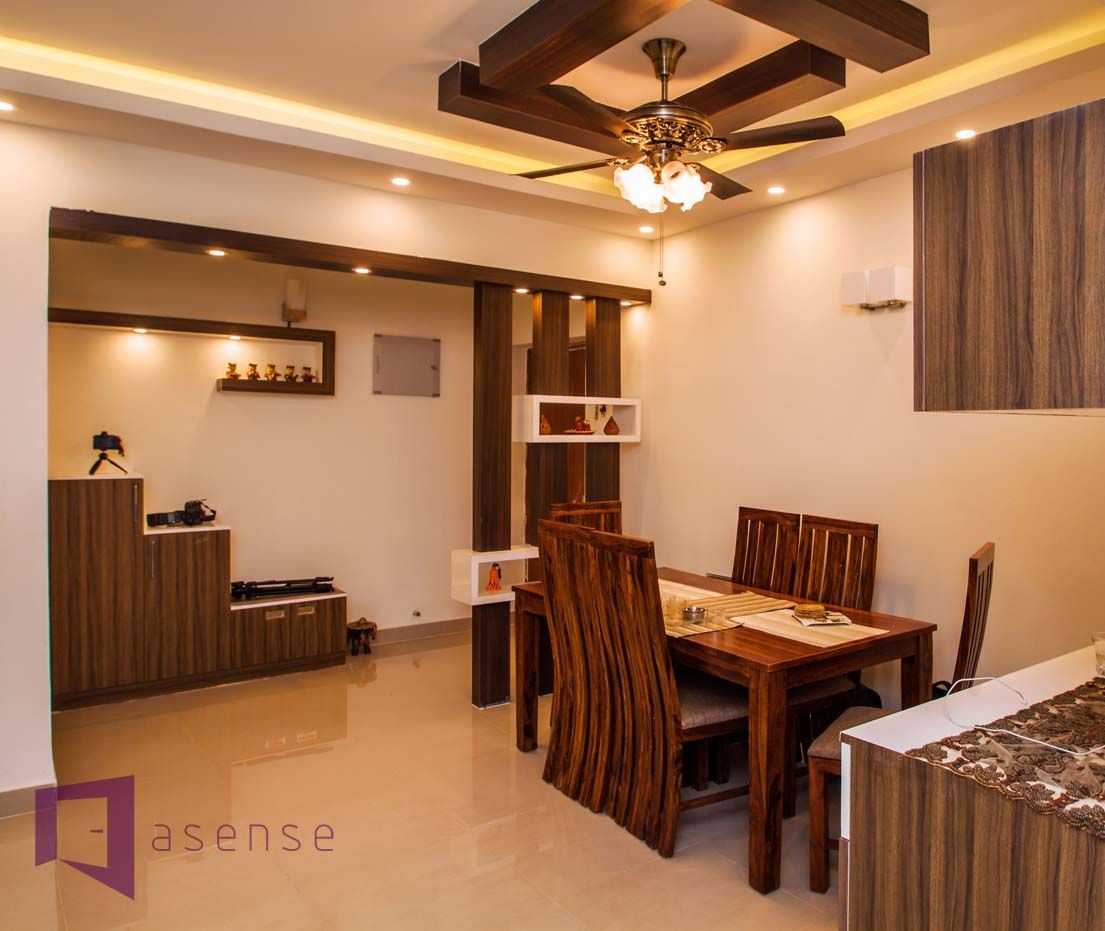 AMIT & SURVI'S INTERIOR IN MERA HOMES APARTMENT, KADUGUDI, Asense Asense モダンデザインの ダイニング 木 木目調 テーブル